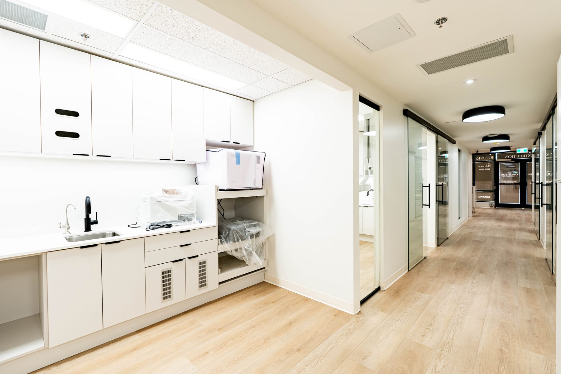 Sterilization bay with sink, cabinetry and instrument storage in a finished clinic